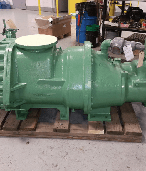 Green compressor airend unit on wooden pallet