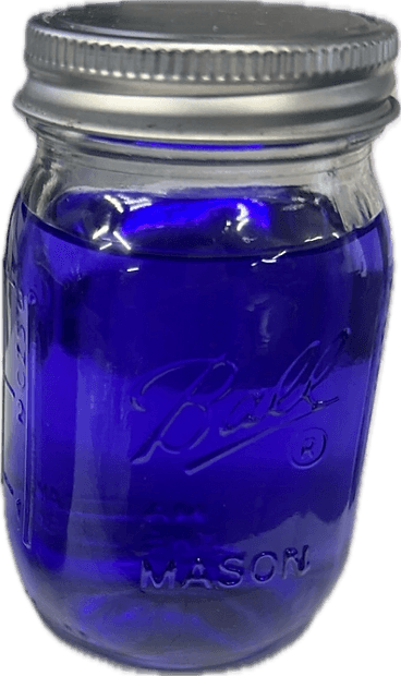 Clean transparent deep purple Skydrol hydraulic fluid in mason jar